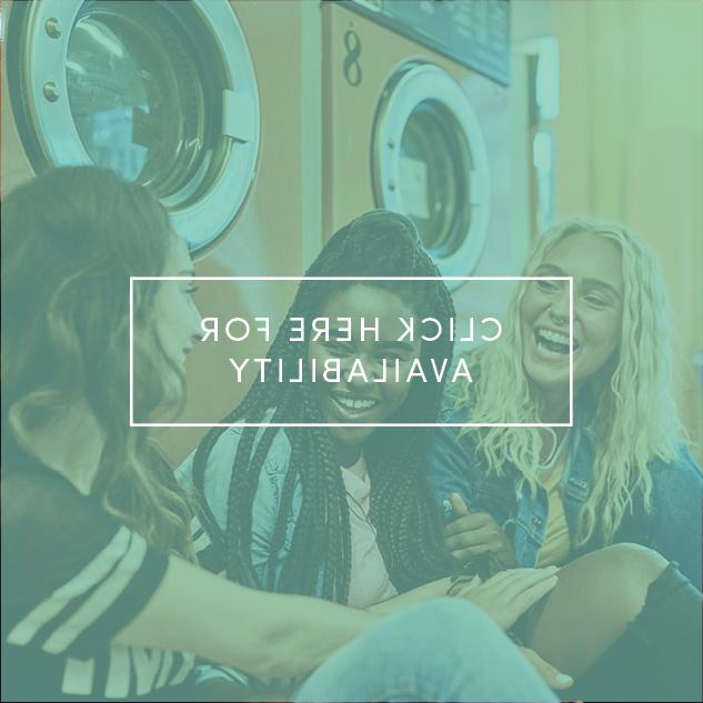 Three females talking sitting in laundry room